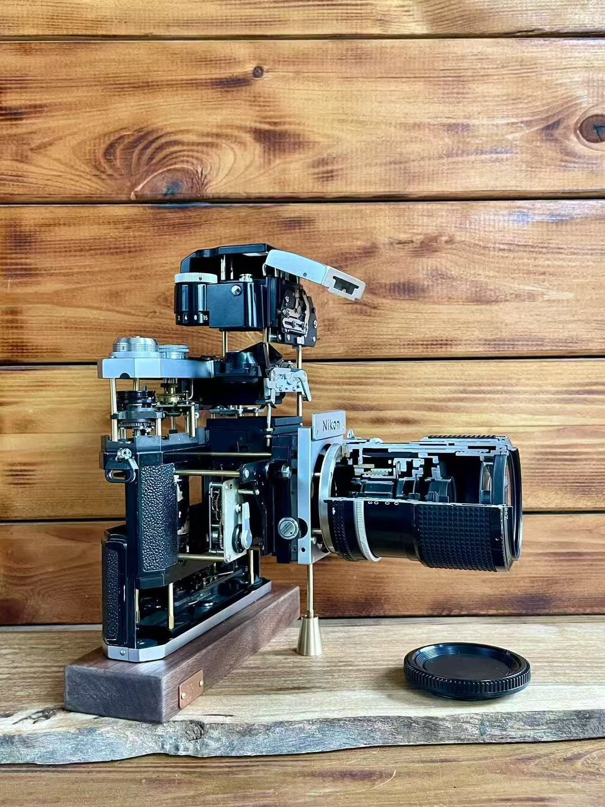 Disassembled Mechanical Film Camera Nikon F With cut lens
