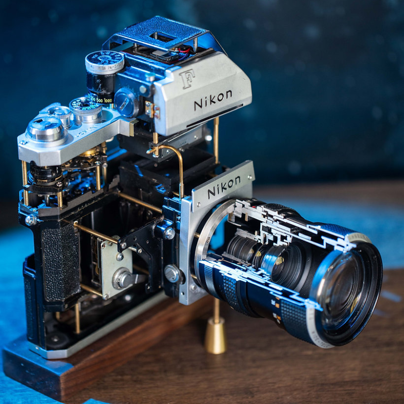 Disassembled Mechanical Film Camera Nikon F With cut lens