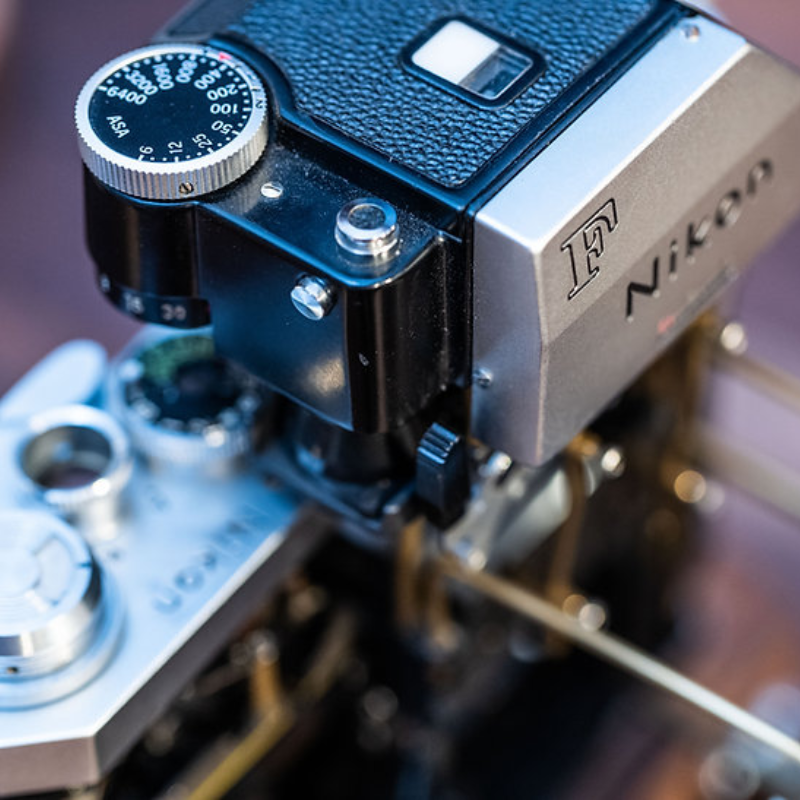 Disassembled Mechanical Film Camera Nikon F With cut lens