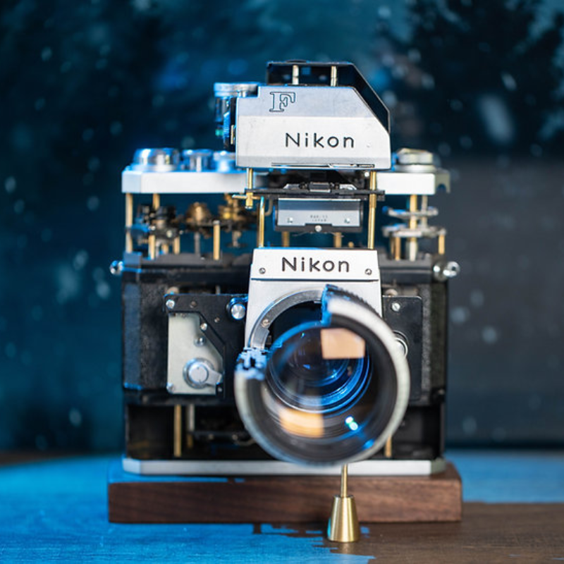 Disassembled Mechanical Film Camera Nikon F With cut lens