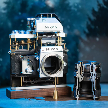Disassembled Mechanical Film Camera Nikon F With cut lens